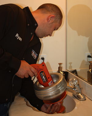 Boca Raton Plumber cleaning drain